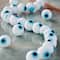 12 Pack: White Evil Eye Glass Round Beads by Bead Landing™